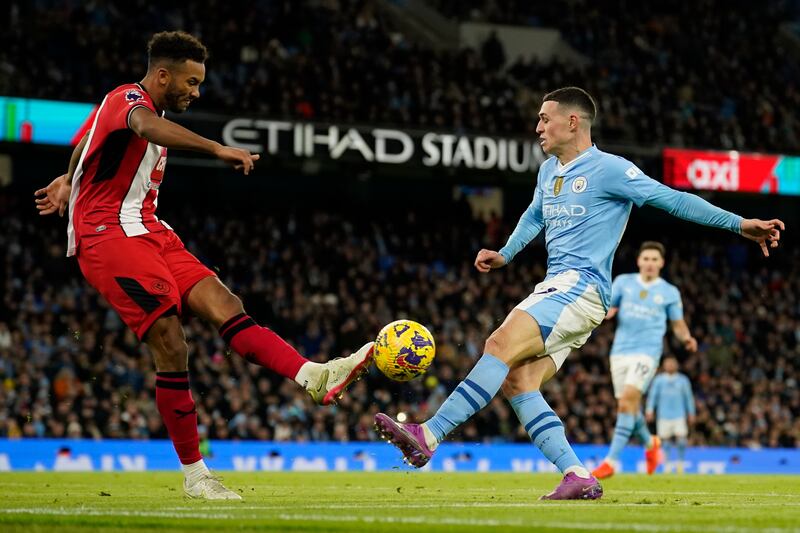 Kept City's forwards at arm's length for most of the first half, as the visitors proved hard to break down and the home side were restricted to shooting from long range. Vital block to deny Foden in second half. Bailed out his keeper in stoppage time. AP 