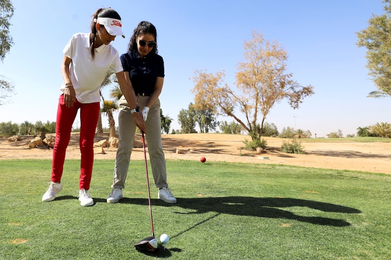 Tunisian golf coach Ghezlan Ahmed trains a Saudi woman in Riyadh.