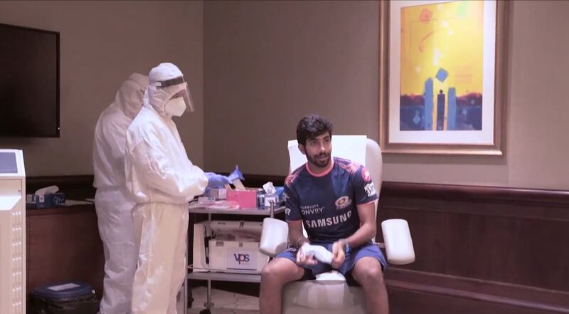 Mumbai Indians bowler Jasprit Bumrah prepares for a PCR test during the IPL 2020 that was played in the UAE