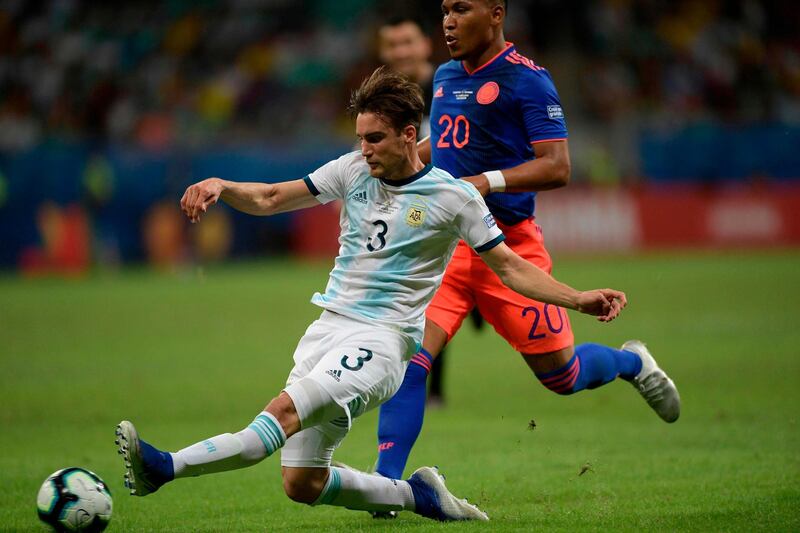 Argentina's Nicolas Tagliafico, left, is challenged by Colombia's Roger Martinez. AFP