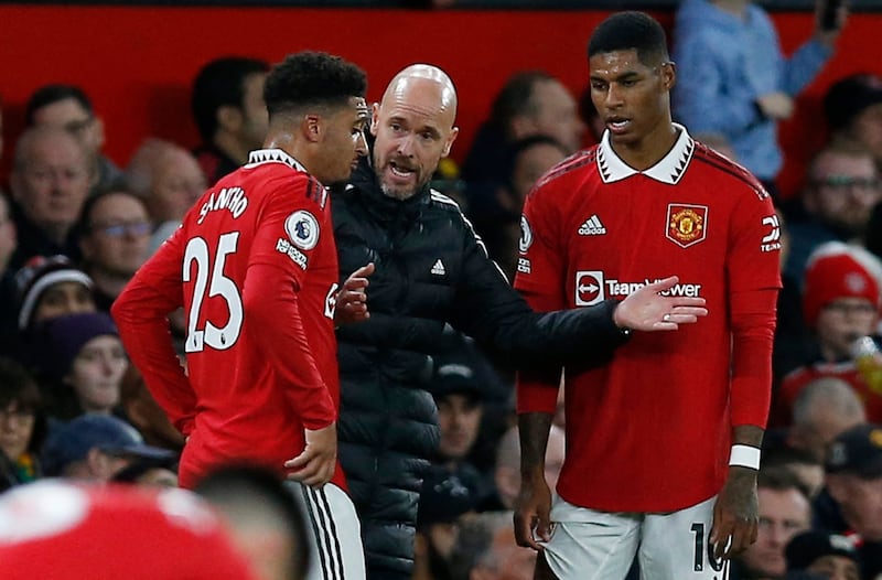 Manchester United manager Erik ten Hag gives instructions to Jadon Sancho and Marcus Rashford. Reuters