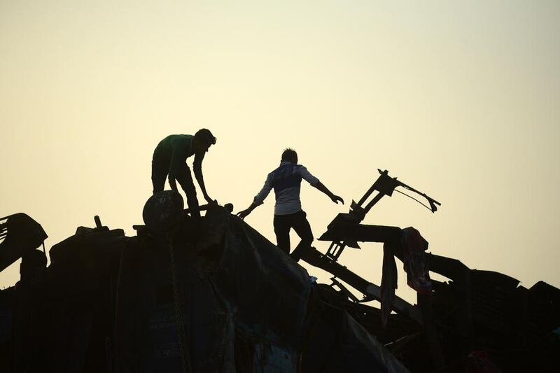 Indian rescue workers search for survivors in the wreckage of a train that derailed near Pukhrayan in Kanpur district, northern India. Sanjay Knojia / AFP Photo
