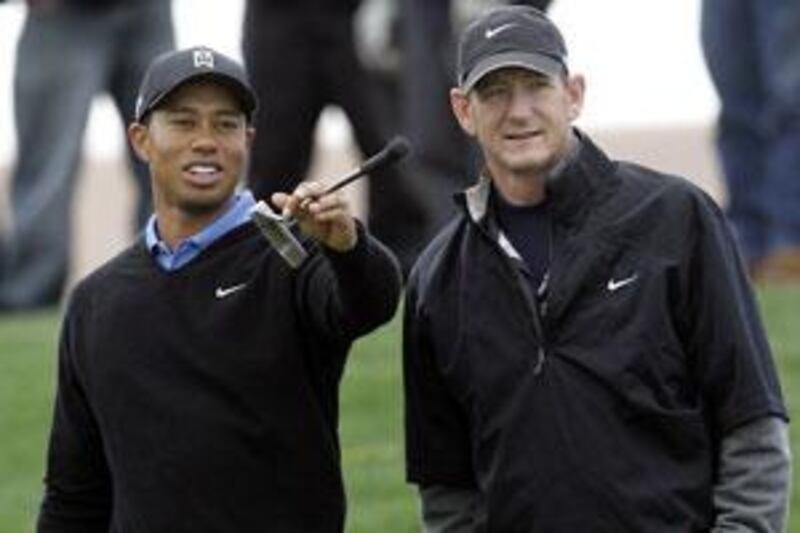 Tiger Woods, left, has parted with Hank Haney.