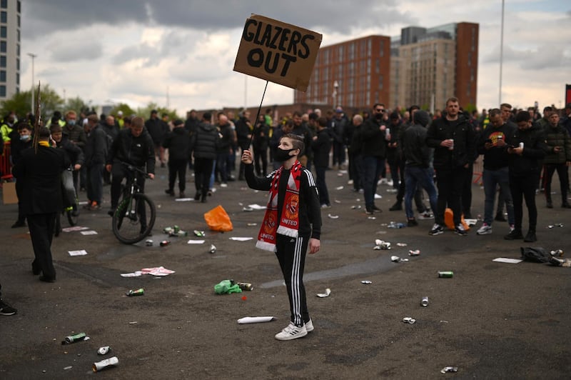 Fans protest against the United owners outside Old Trafford. AFP