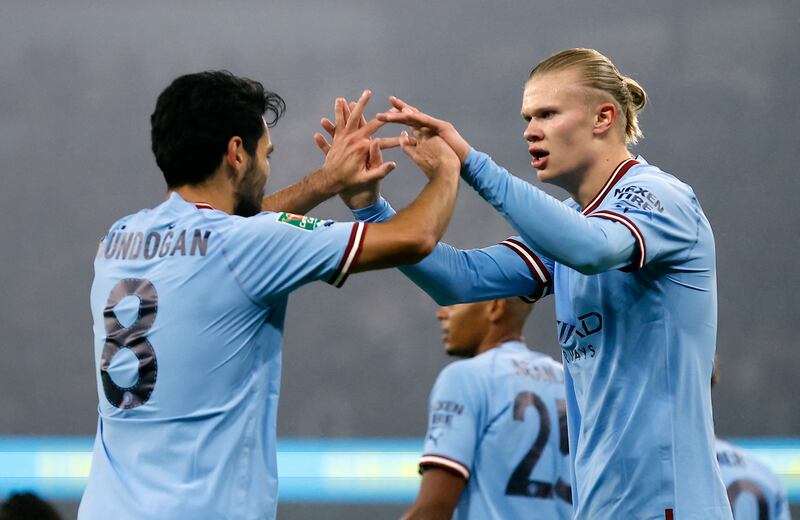 Manchester City's Erling Haaland celebrates scoring the first goal with Ilkay Gundogan. Reuters