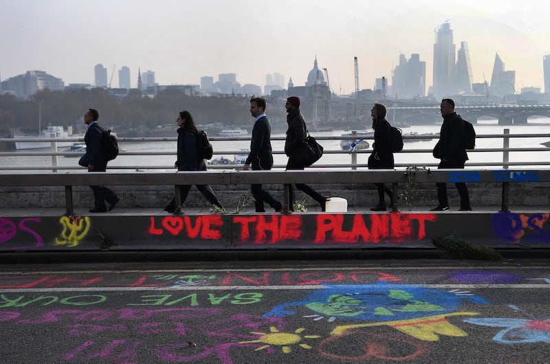 Graffiti on Waterloo Bridge during climate change protests in London. EPA