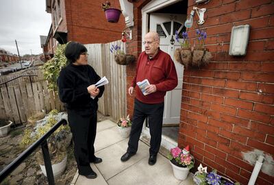 Jihyun Park, who fled North Korea before settling in Britain, talks with a local resident while out delivering leaflets after deciding to stand for election as a Conservative party candidate in the upcoming local elections in the Moorside Ward in Bury, Britain, March 22, 2021. Picture taken March 22, 2021. REUTERS/Phil Noble