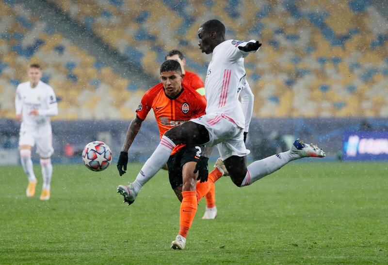 Real Madrid's Ferland Mendy attempts to control the ball under pressure from Shakhtar Donetsk's Dodo. Reuters