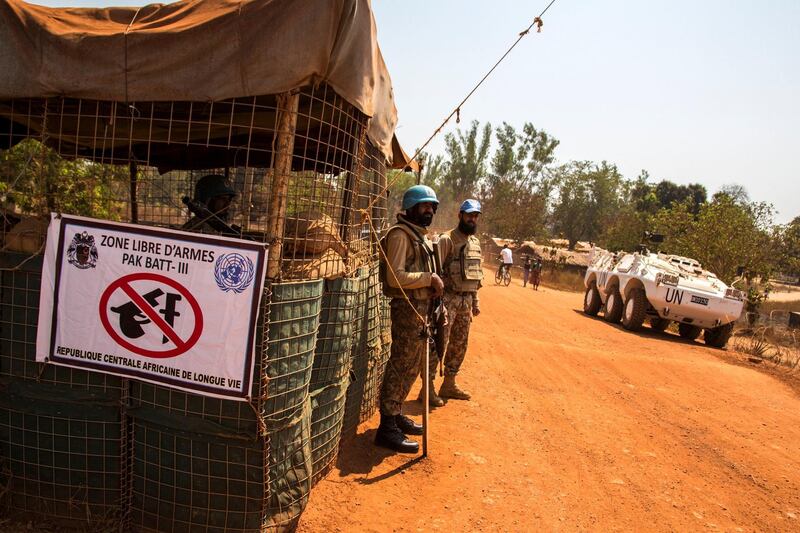 U.N. peacekeepers from the Pakistan Army guard the entrance to a 'weapons-free zone' in Kaga Bandoro, the Central African Republic, where thousands of displaced families shelter in a camp from rival rebel groups