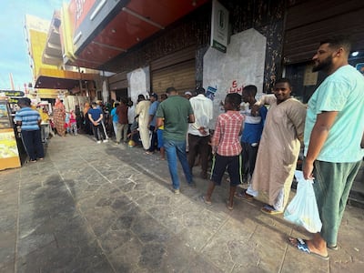People queue to get bread during clashes between the paramilitary Rapid Support Forces and the army in Khartoum. Reuters