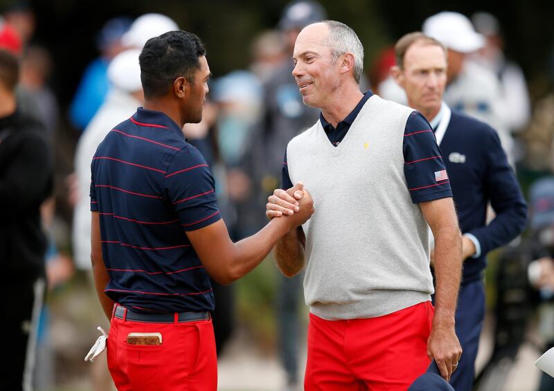 Matt Kuchar and Tony Finau celebrate on the 17th green during Saturday afternoon foursomes. Getty