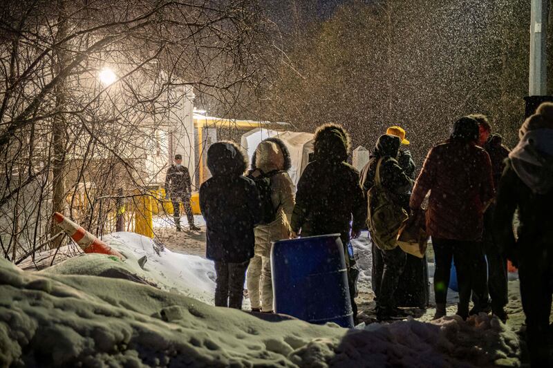 Migrants arrive at the Roxham Road border crossing in Quebec. AFP