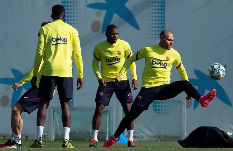 Barcelona's Martin Braithwaite, right, attends his first training session with the team at the Joan Gamper sport complex on Friday. EPA