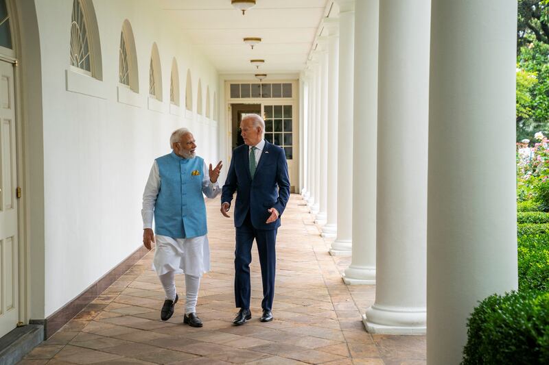 Mr Biden walks with Mr Modi at the White House during the Indian Prime Minister's official visit to Washington. Reuters