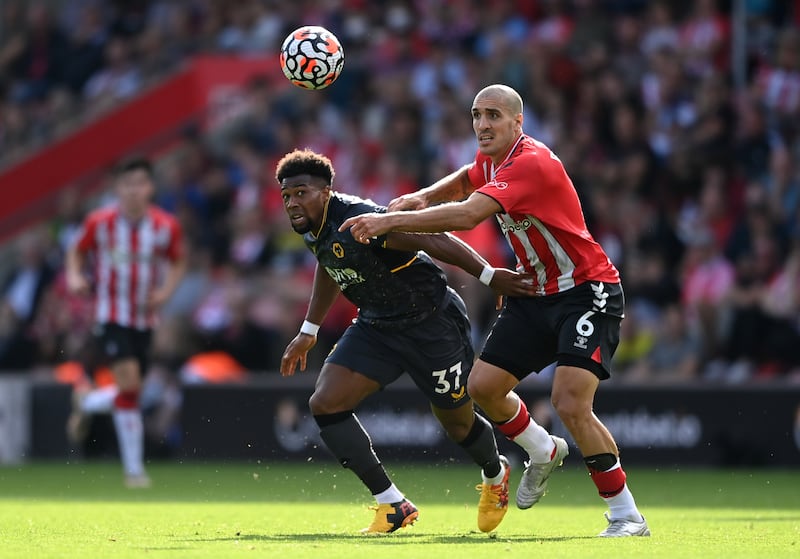 SOUTHAMPTON, ENGLAND - SEPTEMBER 26: Adama Traore of Wolverhampton Wanderers battles for possession with Oriol Romeu of Southampton during the Premier League match between Southampton and Wolverhampton Wanderers at St Mary's Stadium on September 26, 2021 in Southampton, England. (Photo by Alex Davidson / Getty Images)