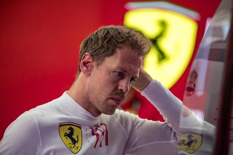 Ferrari's German driver Sebastian Vettel rests during the second practice session ahead of the Formula One Bahrain Grand Prix at the Sakhir circuit in the desert south of the Bahraini capital Manama, on March 29, 2019. The Formula One Bahrain Grand Prix will be held on March 31. / AFP / Andrej ISAKOVIC
