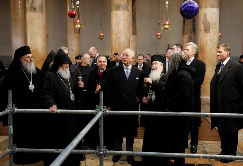 Prince Charles stands next to Theophilos III during a visit to the Church of the Nativity. Reuters