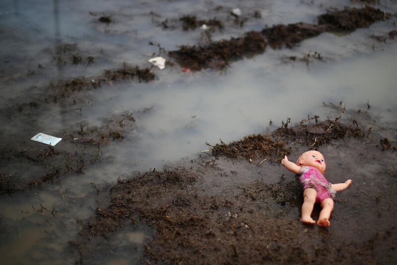 A doll belonging to a migrant is seen on the floor. Reuters