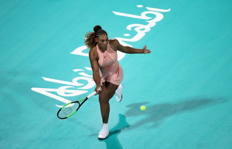 Serena runs around the back of the court to return a shot. Getty