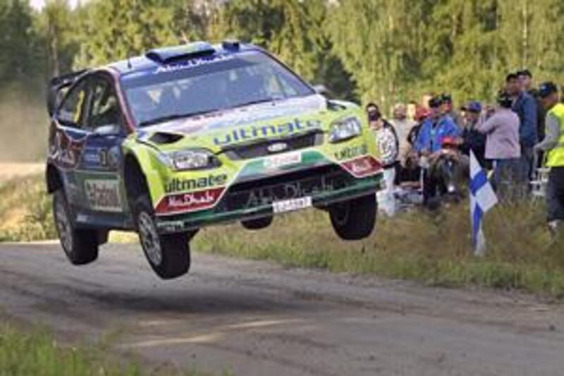 Mikko Hirvonen's Ford leaves the ground yesterday as the Finnish driver speeds to his first victory in the Rally Finland to secure a three-point lead in the drivers' championship.