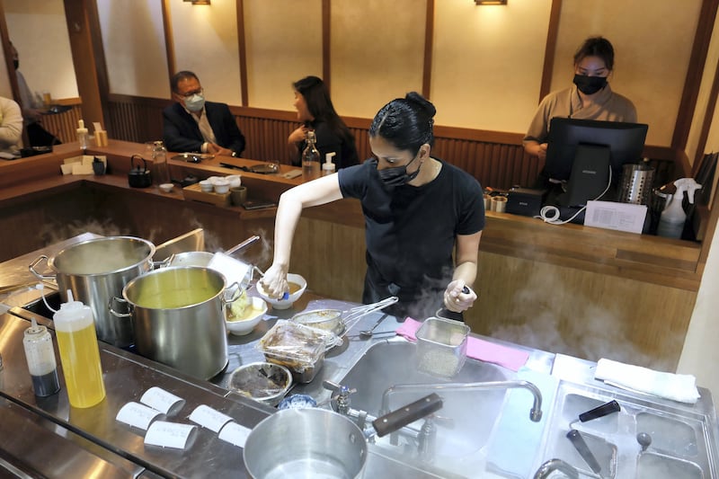 Neha Mishra, owner and founder-chef of Kinoya restaurant preparing food for the guests at the Kinoya restaurant in The Onyx Tower 2 in The Greens in Dubai on May 10,2021. Pawan Singh / The National. Story by Mary Paulose