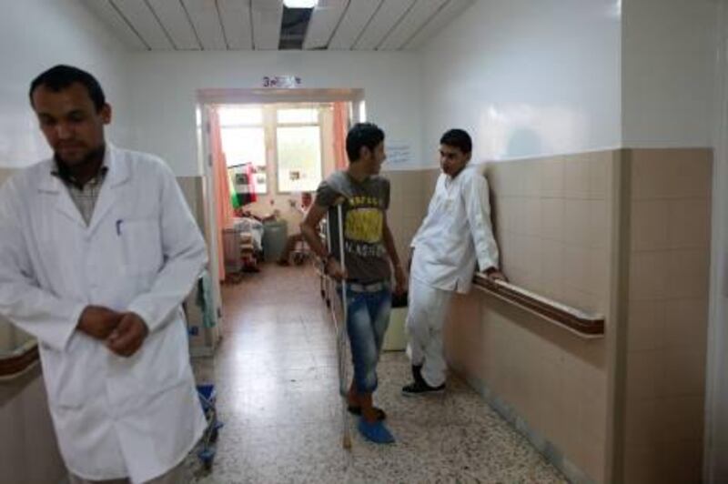 Patients stand in the corridor of the Misrata ward of Al Jalal hospital in Benghazi on June 12. Patients are evacuated regularly to the ward from the Misrata hospital which is overwhelmed with casualties and extremely low on supplies. 50 patients have been transferred in the past week.

Credit: Tracey Shelton