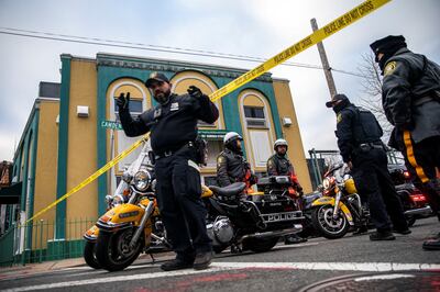 Newark Police Officers stand guard outside the Masjid Muhammad-Newark mosque following the shooting of Imam Hassan Sharif. Reuters