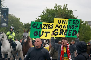 Soccer Football - Premier League - Manchester United v Liverpool - Old Trafford, Manchester, Britain - May 13, 2021 Manchester United fans protest against their owners outside the stadium before the match REUTERS/Phil Noble