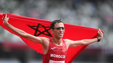 El Amin Chentouf celebrates after winning the gold medal in the marathon T12 at the Tokyo 2020 Paralympic Games. Getty Images