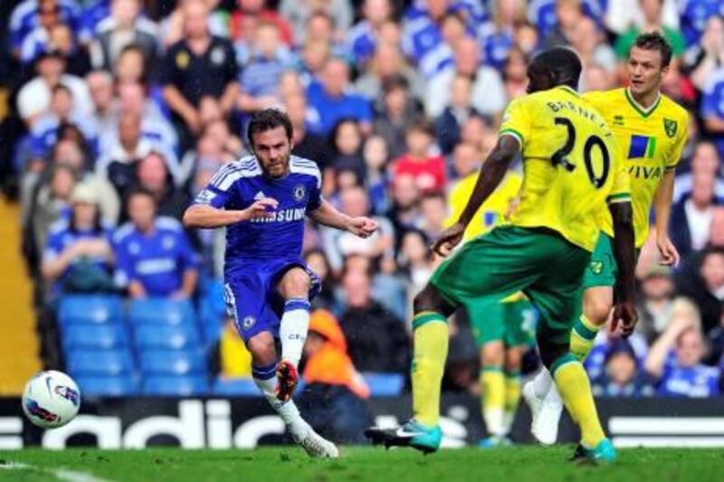 Chelsea's Spanish midfielder Juan Mata (L) scores the third goal on his debut during the English Premier League football match between Chelsea and Norwich City at Stamford Bridge in London, on August 27, 2011. AFP PHOTO/GLYN KIRK

RESTRICTED TO EDITORIAL USE. No use with unauthorized audio, video, data, fixture lists, club/league logos or “live” services. Online in-match use limited to 45 images, no video emulation. No use in betting, games or single club/league/player publications.
 *** Local Caption ***  693569-01-08.jpg