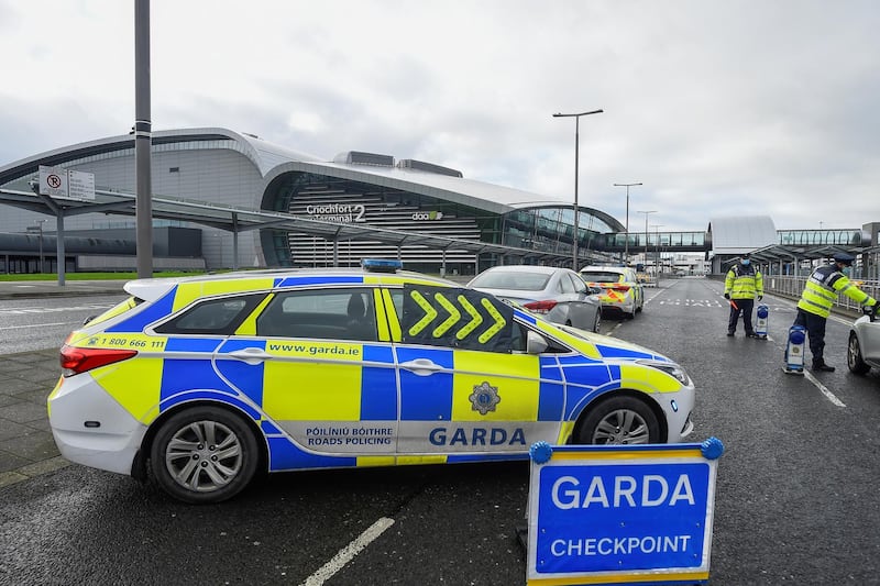 Garda (Irish police) officers monitor drivers to check if they have a valid reason for travel, amid the outbreak of the coronavirus disease (COVID-19), at a checkpoint outside Dublin Airport, Ireland, January 29, 2021. REUTERS/Clodagh Kilcoyne