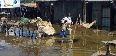 Displaced Chadians flee their homes with their belongings following a massive flood in the capital N'Djamena. Reuters