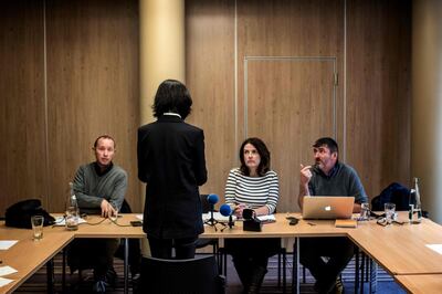 Grace, the wife of the missing Interpol president Meng Hongwey, talks to journalists on October 7, 2018 in Lyon during a press conference during which she did not want her face to be shown, a day after Interpol demanded an official "clarification" from China on the whereabouts of its missing police chief, after reports said he was detained for questioning on arrival in his homeland. Beijing has remained silent over the mysterious disappearance of Meng Hongwei, who was last seen leaving for China in late September from the Interpol headquarters in Lyon, southeast France, a source close to the enquiry told AFP. / AFP / JEFF PACHOUD
