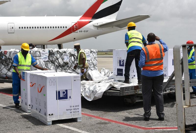 Boxes of the AstraZeneca vaccine are unloaded from an Emirates flight in the Ivory Coast. AFP