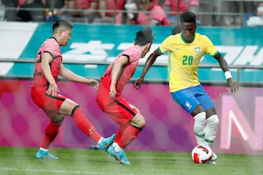 Vinicius Jr (R) of Brazil in action during the International friendly soccer match between South Korea and Brazil at Sangam World Stadium in Seoul, South Korea, 02 June 2022.   EPA / JEON HEON-KYUN