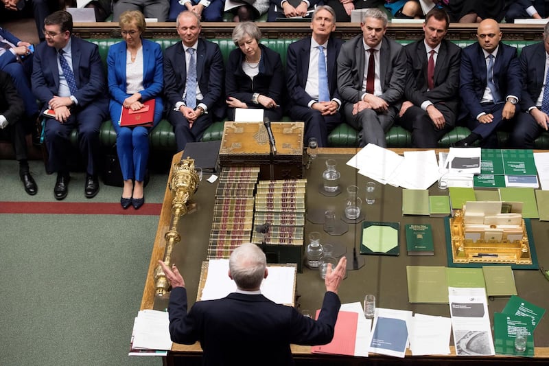 A handout photograph released by the UK Parliament shows Britain's main opposition Labour Party leader Jeremy Corbyn (C bottom) giving his response and informing the House that he has tabled a motion of no confidence in the Government in the House of Commons in London on January 15, 2019, after MPs rejected the government's Brexit deal as Britain's Prime Minister Theresa May (C top) listens. - Britain's parliament on Tuesday resoundingly rejected Prime Minister Theresa May's Brexit deal, triggering a no-confidence vote in her government and leaving the country on track to crash out of the EU. (Photo by Jessica TAYLOR / UK PARLIAMENT / AFP) / RESTRICTED TO EDITORIAL USE - NO USE FOR ENTERTAINMENT, SATIRICAL, ADVERTISING PURPOSES - MANDATORY CREDIT " AFP PHOTO / Jessica Taylor / UK Parliament"