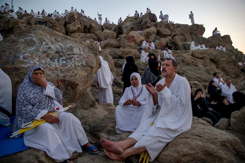 Pilgrims pray on Mount Arafat, or the mountain of forgiveness, during Hajj. AP Photo