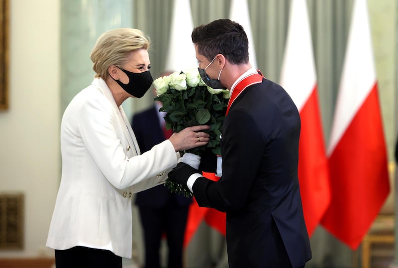 Robert Lewandowski is greeted by Polish First Lady Agata Kornhauser-Duda. EPA