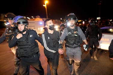 Israeli policemen arrest Palestinian protesters during a demonstration supporting Palestinian families who were ordered to be evicted from Sheikh Jarrah neighborhood in East Jerusalem. EPA