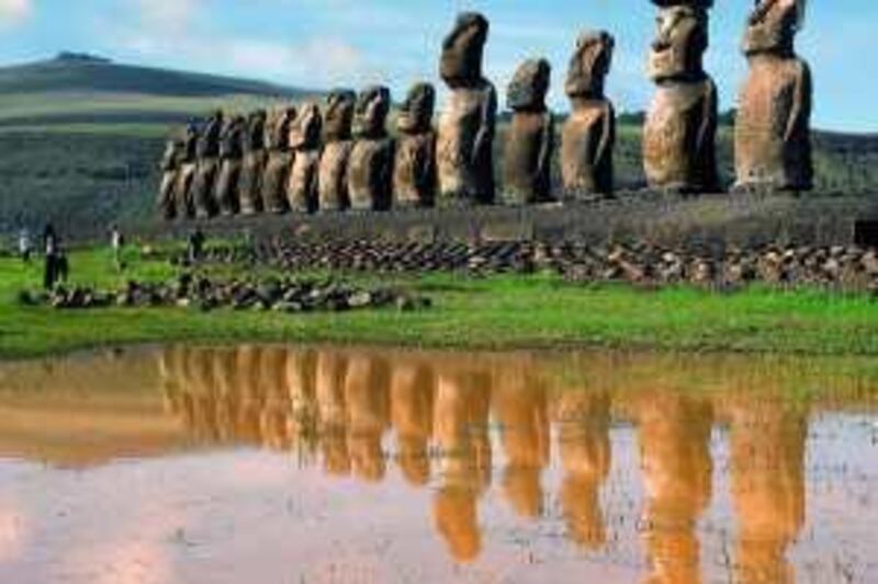 ** FILE ** In this Feb. 2007 file photo, giant volcanic rock statues called Moais are shown on Easter Island in the South Pacific. Easter Island is Earth's most remote inhabited land, a South Pacific speck of volcanic rock so isolated the locals call it "Te Pito O Te Henua," or "The Navel of the World."  (AP Photo/La Tercera, File)