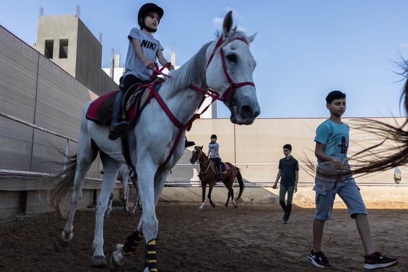 Children practise horse riding at Friends Equestrian Club in Gaza.