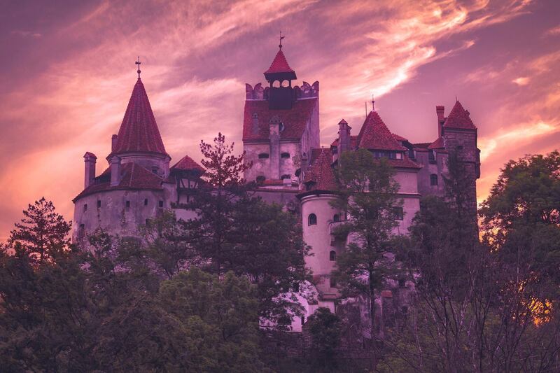 Bran, Romania - June 6, 2016: Sunset at the 14th century Bran castle, famous for the dracula legend. The castle is now a museum and open for tourists.