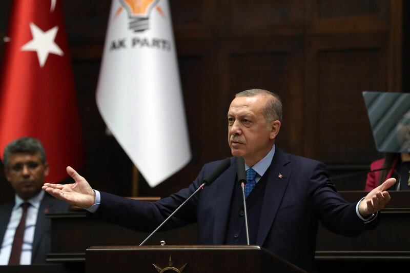 Turkish President and leader of the Justice and Development Party (AK Party) Recep Tayyip Erdogan delivers a speech during the AK Party's parliamentary group meeting at the Grand National Assembly of Turkey (TBMM) in Ankara, on April 24, 2018. / AFP PHOTO / ADEM ALTAN