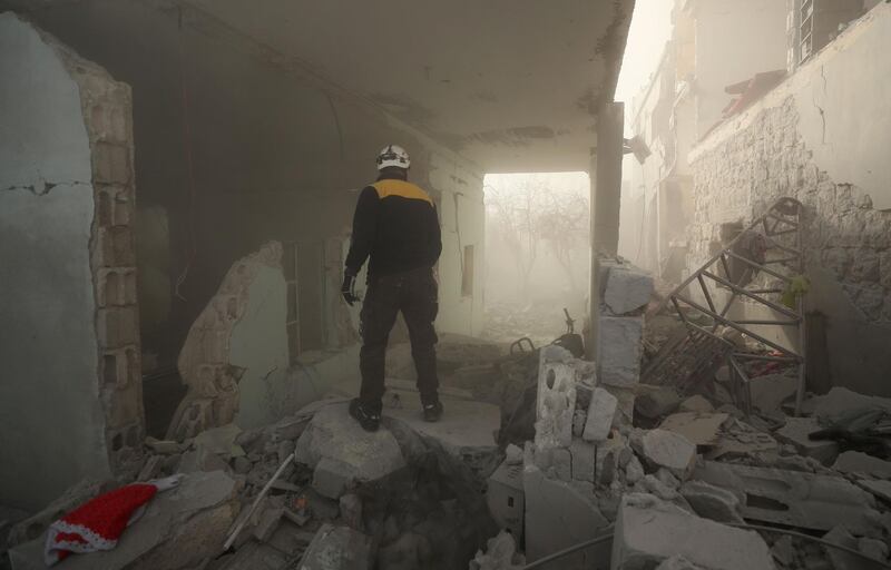 Members of the Syrian Civil Defence, also known as the White Helmets, and other people search for victims and survivors from the rubble. AFP