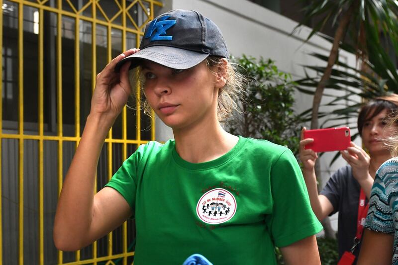Detained Belarusian model Anastasia Vashukevich known by her pen name Nastya Rybka arrives Thai immigration department in Bangkok on January 17, 2019 during her deportation together with other associates after pleading guilty in court to multiple charges including solicitation and illegal assembly. A Belarusian model who claimed she had proof of Russian efforts to help Donald Trump win office is to be deported after being convicted on January 15 nearly a year after her arrest in Thailand for participating in a "sex training course". / AFP / Lillian SUWANRUMPHA
