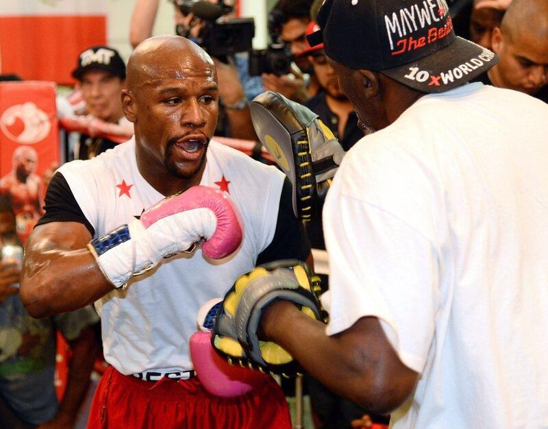 Floyd Mayweather spars during his training session on Tuesday at the Mayweather Boxing Club in Las Vegas. Ethan Miller / Getty Images / AFP / April 22, 2014