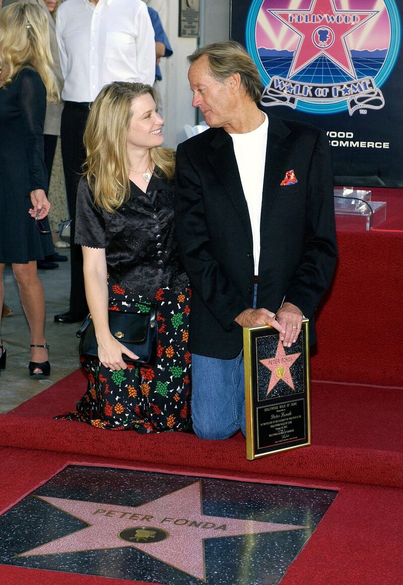 Fonda and his daughter, actress Bridget Fonda, attend his Hollywood Walk of Fame ceremony. Getty.