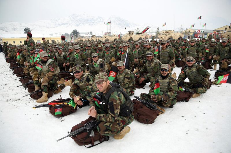 Afghan Army commandos attend their graduation ceremony in thick snow in Kabul. AP Photo