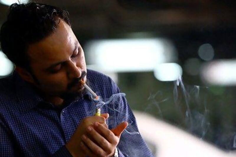 UAE retailers believe a proposed tax on tobacco products will largely fail to reduce sales of cigarettes even if prices are hiked by as much as 30 per cent. Satish Kumar / The National