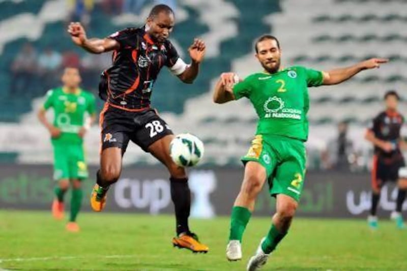 Boris Kabi, left, hopes to avenge the 2010 Etisala Cup final defeat to Al Jazira this season, with his Ajman team currently top of Group C ahead of Sunday's final round of group games. Al Ittihad